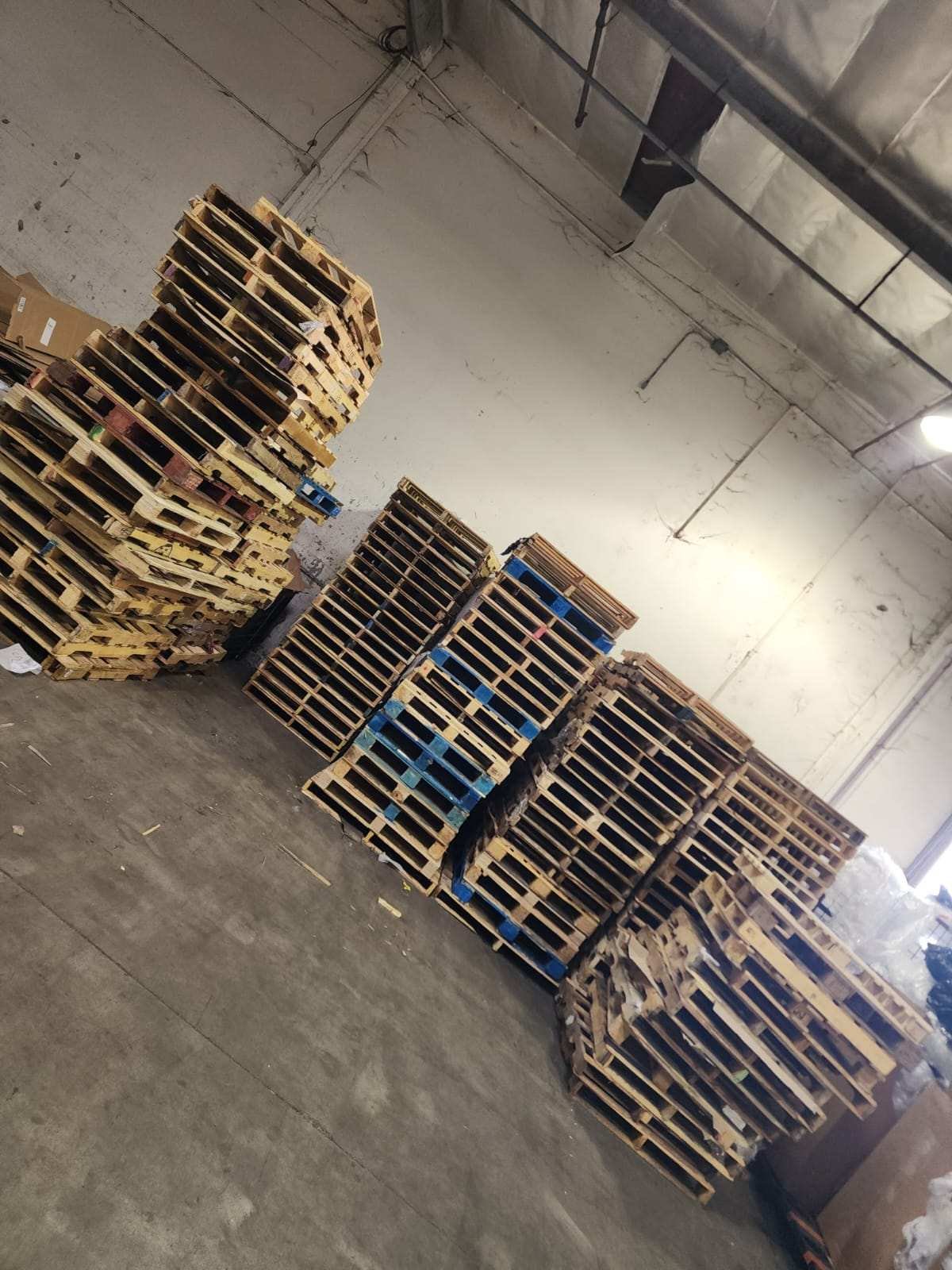 Organized warehouse with safely stored pallets following proper storage safety practices