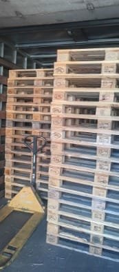 Stack of ISPM-15 compliant pallets with visible IPPC stamp